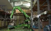 Maeda MK3053 spider crane operating inside an industrial warehouse