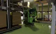 Maeda MK3053 compact spider crane maneuvering in a narrow indoor space